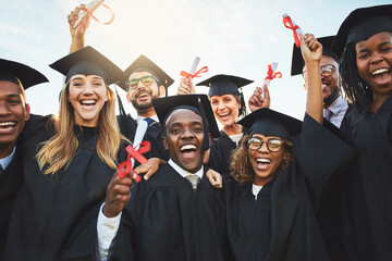 Sticker - We worked hard to get here. Shot of a group of cheerful university students on graduation day.