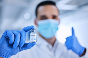 Poster - I fully back this vaccine. Cropped shot of an unrecognizable male scientist holding up a bottle of the covid 19 vaccine.
