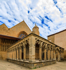 Wall Mural - Ornate medieval stone columns and the facade of the Santa Maria la Real church in Olite, Spain famous for a magnificent Royal Palace castle