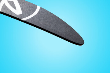 Sticker - The sliding surface of a cross-country ski is close-up. Cross-country ski sock on a blue background