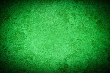 Texture of green decorative plaster or concrete with vignette.