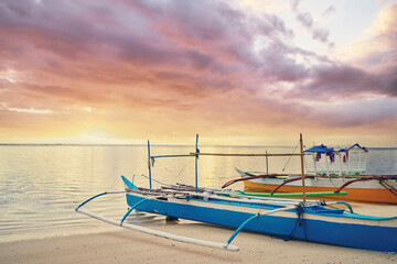 Sticker - Beautiful colorful sunrise on the seashore with fishing boats. Philippines, Siargao Island.