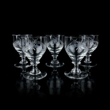 Set Of Crystal Antique Wine Glasses. Vintage Glass Set Of Glasses For Alcoholic Drinks On A Black Isolated Background