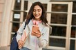 © Krakenimages.com - Young middle east student girl smiling happy using smartphone at the city.