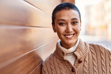 Sticker - Beautiful hispanic woman with short hair smiling happy outdoors