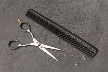 Stylish professional barber scissors, hair cutting shears on black background. Hairdresser salon equipment concept, hairdressing set