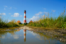 Lighthouse Westerhever In Schleswig Holstein, Germany. View On Landscape By National Park Wattermeer In Nordfriesland.