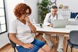 © Krakenimages.com - Senior woman sitting at doctor appointment feeling unwell and coughing as symptom for cold or bronchitis. health care concept.