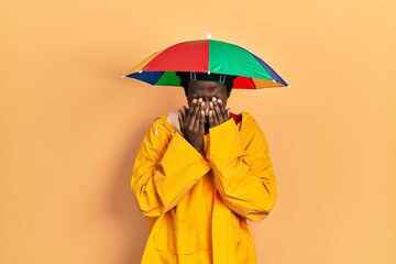 Sticker - Young african american man wearing yellow raincoat rubbing eyes for fatigue and headache, sleepy and tired expression. vision problem