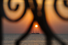 Beautiful Sunset With Silhouette Yacht Over The Sea.