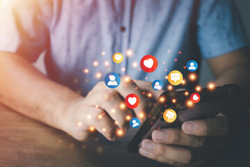 Wall Mural - Social media technology concept, man hand using smartphone Login to the online network Use social media to do business and marketing payment from home through the Internet.