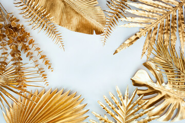 Creative nature layout made of tropical leaves. Summer concept. Fern Palm and monstera leaf on white background.