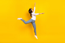 Photo Of Adorable Shiny Woman Wear White Shirt Jumping High Dancing Isolated Yellow Color Background