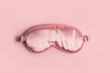 © Branislava - Pink silk sleeping mask on a pastel pink background