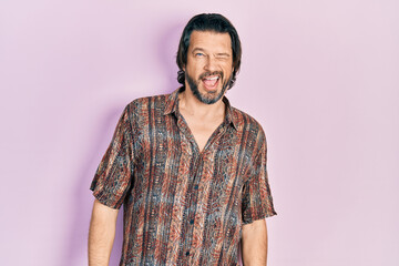 Poster - Middle age caucasian man wearing casual clothes winking looking at the camera with sexy expression, cheerful and happy face.