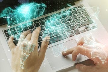 multi exposure of abstract creative digital world map and hand typing on computer keyboard on backgr