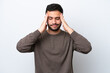 © luismolinero - Young Brazilian man isolated on white background with headache