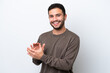 © luismolinero - Young Brazilian man isolated on white background applauding