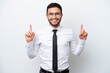 © luismolinero - Business Brazilian man isolated on white background pointing up a great idea