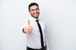 © luismolinero - Business Brazilian man isolated on white background with thumbs up because something good has happened
