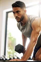 Aufkleber - Life has ups and downs, we call them reps. Shot of a young man working out with dumbbells in a gym.