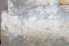 Old Flaky Wall With Destroyed Plaster. Renovation Of Old House. Industrial Style Design Wall Background. Grunge Cracked Concrete Wall With Old Paint. Shabby Peeling Old Background