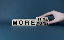 More Money Or More Time. Cubes Form Words More Money Or More Time.