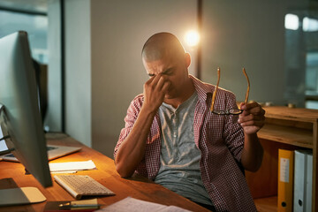 Aufkleber - Struggling to stay awake. Cropped shot of a young designer looking stressed out while working late in an office.
