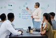 © C Coetzee/peopleimages.com - Outlining the way forward. Shot of a mature businesswoman using a whiteboard during a presentation to her colleagues in an office.