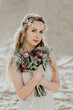Bridesmaid with bouquet.