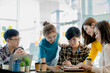 © kamiphotos - Groups of people gathered in the conference room, they were having a brainstorming meeting and planning meetings to manage the company's growth and profit. Management concept from the new generation.