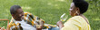 © LIGHTFIELD STUDIOS - cheerful and senior african american couple drinking wine during picnic, banner.