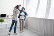 © LIGHTFIELD STUDIOS - full length of cheerful senior african american couple dancing in kitchen.