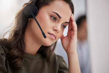 Poster - Its difficult to stay calm with rude callers. Shot of a young call centre agent looking stressed out while working in an office.
