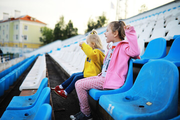 Plastic chairs in the stands of a sports stadium. Cheer on the stands of the stadium.