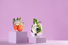 Summer Refreshing Fruit And Berry Infused Detox Water On Podiums In Pink Color, Creative Summer Beverages Background