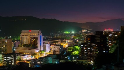 Wall Mural - Nagasaki, Japan. A night timelapse made from a hill in Nagasaki, Japan, with over the entire center, including the hills. Time-lapse at night