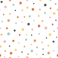 Polka dot seamless pattern with colorful circles on a white background.