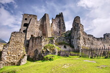Medieval Ruins Panorama Or Castle With Beautiful Blue Sky And Green Meadow. View Of Likava Castle Ruin In Likavka Village In Slovakia.