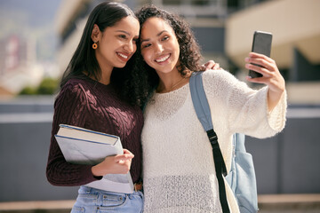 Wall Mural - It wouldnt be college without my favourite. Shot of two young women taking selfies together at college.