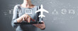 © Tierney - Flight ticket booking concept with business woman using a tablet computer