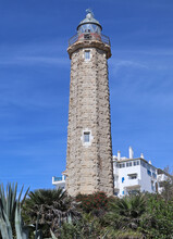 The Lighthouse At Estepona In Spain. It Stands On The Headland Known As Punta Doncella At The West End Of La Rada Beach , Close To The Marina