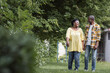© LIGHTFIELD STUDIOS - full length of happy senior african american couple holding hands and walking in park.
