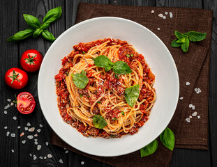 Sticker - Traditional italian spaghetti bolognese on a dark background