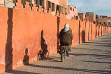 Bicycle And Its Shadow On The Orange Rampart Of Marrakech
