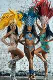 The beautiful women that keep the night alive. Shot of beautiful samba dancers posing against a wall outside.