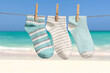 © Pixel-Shot - Rope with clean socks outdoors at sea resort