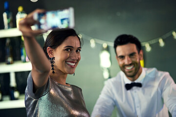 Poster - I want to remember this night. Shot of a young woman taking a selfie with the bartender in a nightclub.