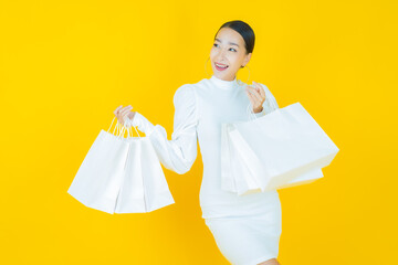 Wall Mural - Portrait beautiful young asian woman smile with shopping bag