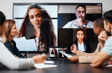 Poster - Meeting with international colleagues. Cropped shot of a diverse group of businesspeople sitting in the boardroom during a meeting with their international colleagues via video chat.